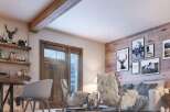 Rustic mountain retreat with wood-beamed ceilings and a cozy living area.