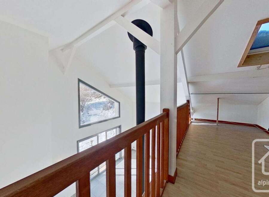 This stunning property boasts a spacious open-plan living area with large windows offering breathtaking views.