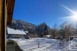 This stunning chalet boasts a picturesque snow-covered landscape, offering breathtaking mountain views and abundant sunshine.