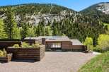 This stunning log home boasts a picturesque setting nestled in the mountains, offering breathtaking views.