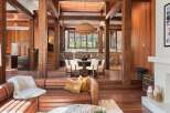 This stunning home boasts a spacious open floor plan with exposed wooden beams, creating a warm and inviting atmosphere.