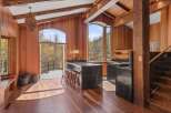 This stunning property boasts a spacious, open-concept kitchen with a large island and bar seating, perfect for entertaining.