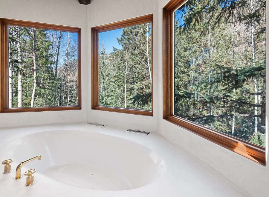 Indulge in tranquility with this luxurious bathroom boasting a spacious soaking tub, perfect for relaxation.