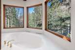 Indulge in tranquility with this luxurious bathroom boasting a spacious soaking tub, perfect for relaxation.