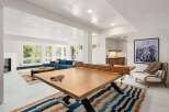 This stunning property boasts a spacious recreation area with a custom-made ping pong table, perfect for entertaining guests.