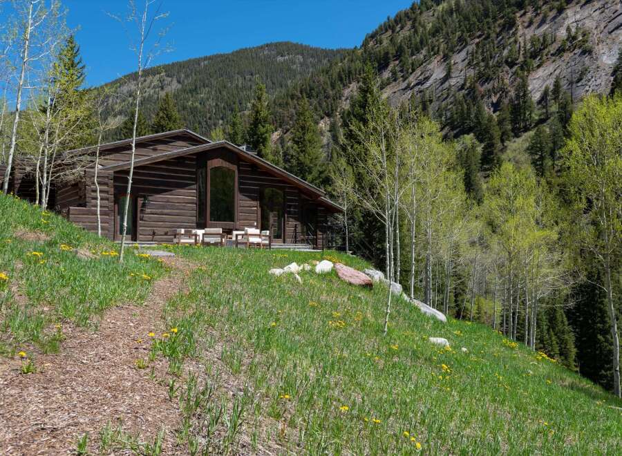 This stunning log cabin nestled in the mountains offers breathtaking views and a tranquil escape.