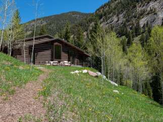 This stunning log cabin nestled in the mountains offers breathtaking views and a tranquil escape.