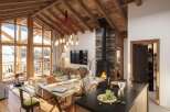 Luxury chalet apartment with stunning mountain views and spacious open-plan living.