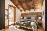 Cozy chalet bedroom with wooden beams, ensuite bathroom, and balcony access.