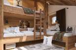 Rustic-chic bunk beds create a cozy haven in this charming chalet bedroom.