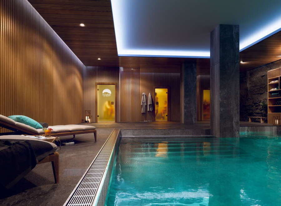 Indulge in our luxurious spa featuring a stunning indoor pool, private treatment rooms, and relaxation areas.