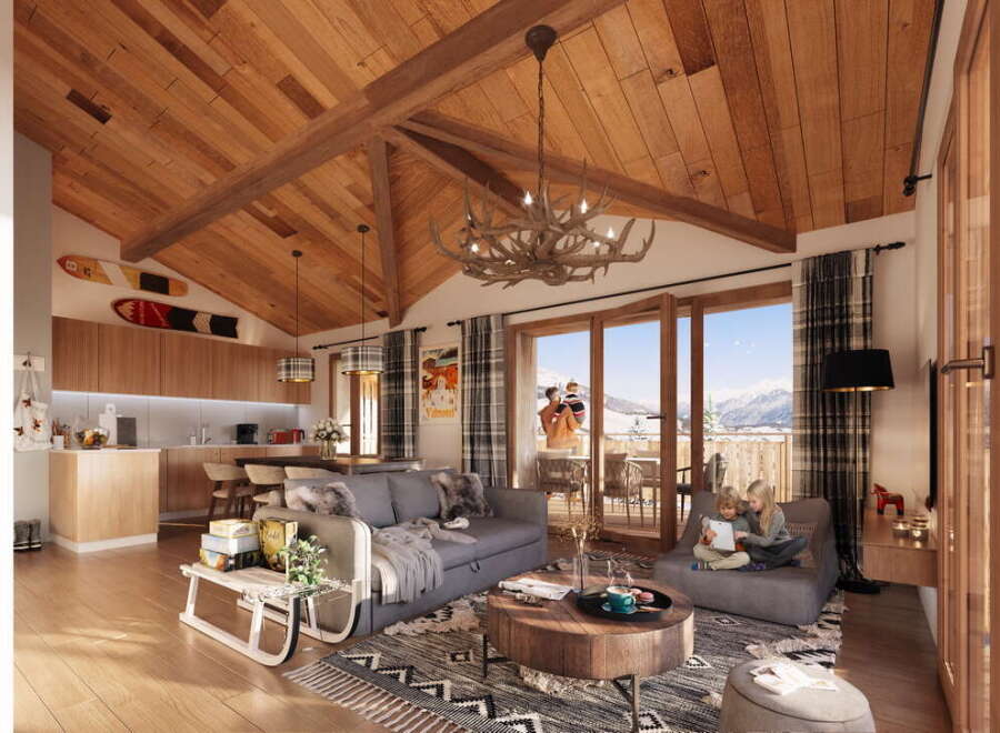 This stunning chalet boasts a spacious open-plan living area with vaulted wooden ceilings and large windows offering breathtaking mountain views.