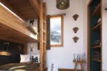 Cozy bunk beds in a rustic-chic room, perfect for a family getaway.