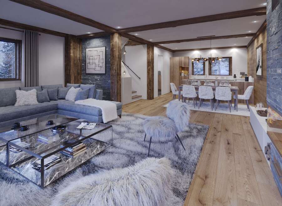 This stunning chalet boasts an open-plan living area with a cozy fireplace, perfect for relaxing after a day on the slopes.