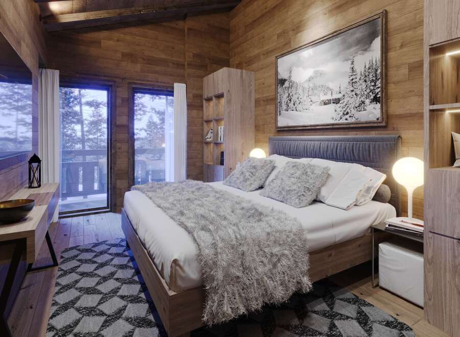 Cozy mountain cabin bedroom with stunning views.