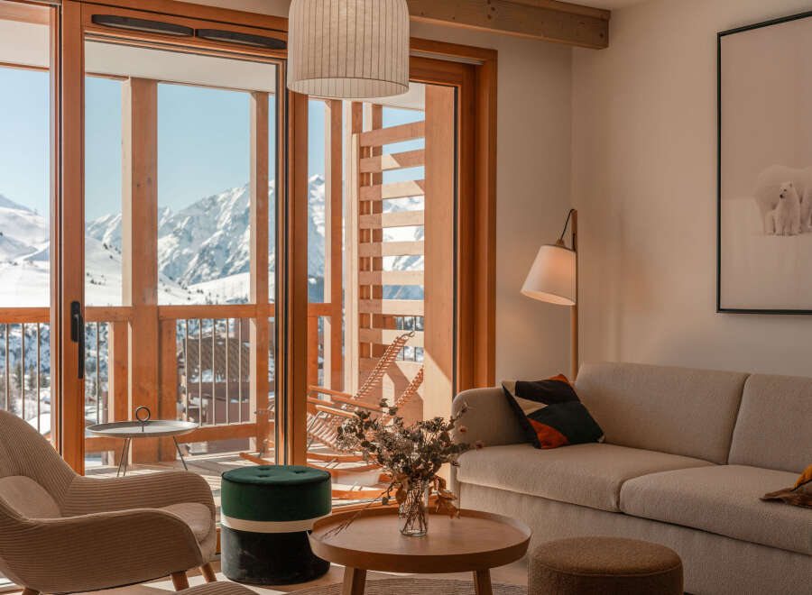 This stunning apartment boasts breathtaking mountain views from its expansive windows and private balcony.