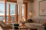 This stunning apartment boasts breathtaking mountain views from its expansive windows and private balcony.