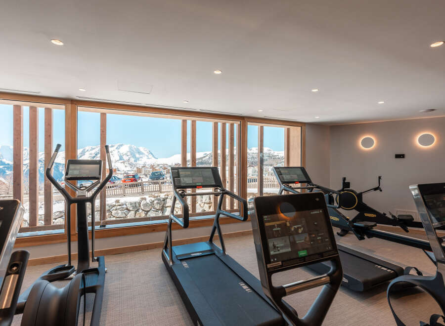 Luxury chalet with stunning mountain views and a state-of-the-art fitness center.