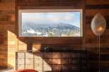 Mountain view chalet with rustic wooden walls and a unique filing cabinet.