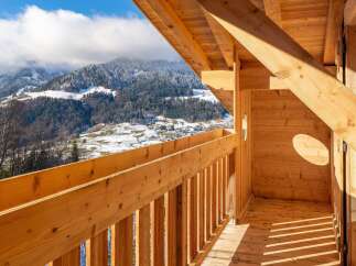Wake up to breathtaking mountain views from this stunning wooden chalet.