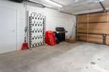 This spacious garage boasts ample storage solutions, including a dedicated boot dryer and ample space for seasonal items.