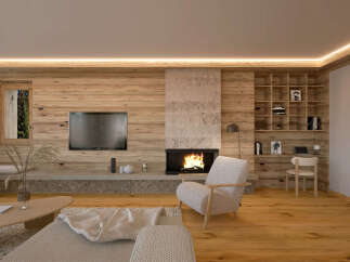 This stunning living room boasts a cozy fireplace, built-in shelving, and a large TV, perfect for relaxing evenings.