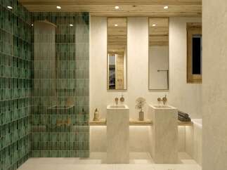 This luxurious bathroom boasts a stunning green tile shower, complemented by sleek, minimalist sinks and mirrors.
