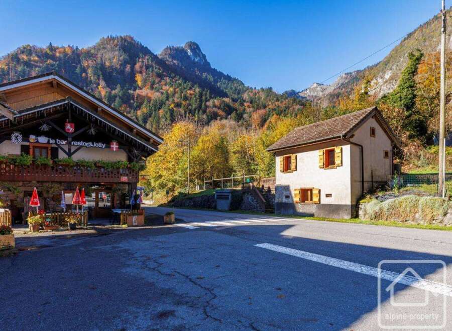 Charming chalet-style house nestled in the heart of the French Alps, boasting stunning mountain views and a tranquil setting.