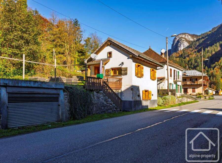 Charming renovated village house with garage and stunning mountain views.