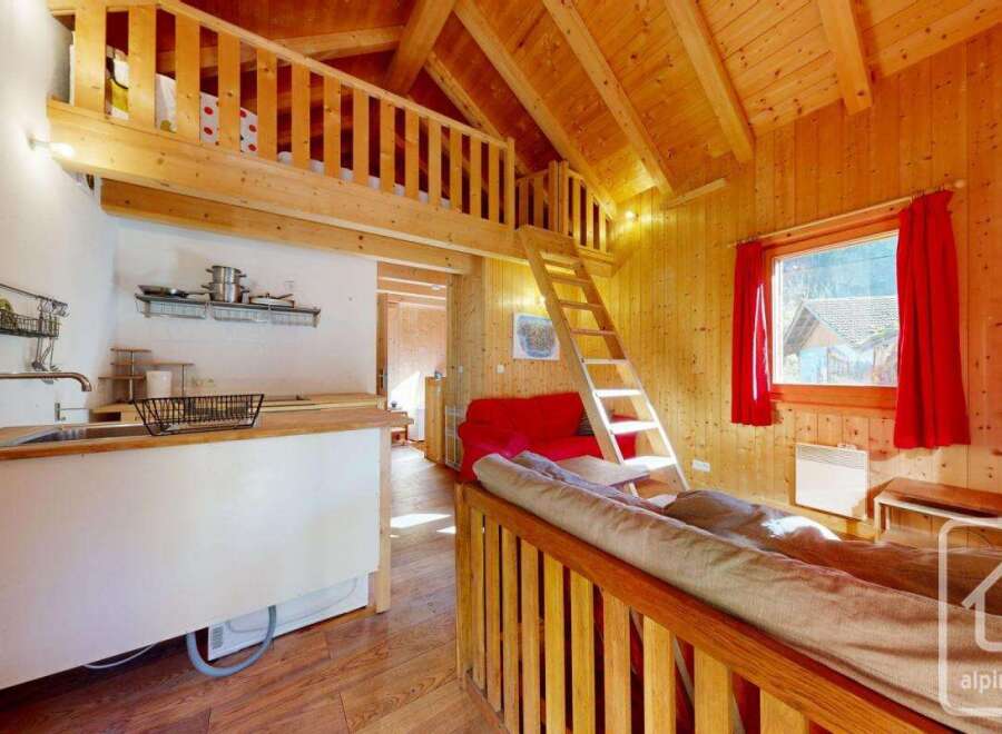 Cozy chalet apartment with a loft bedroom, perfect for a couple's getaway.