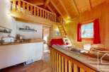 Cozy chalet apartment with a loft bedroom, perfect for a couple's getaway.