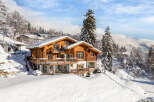 Experience the ultimate winter escape in this stunning chalet nestled in a snowy landscape.