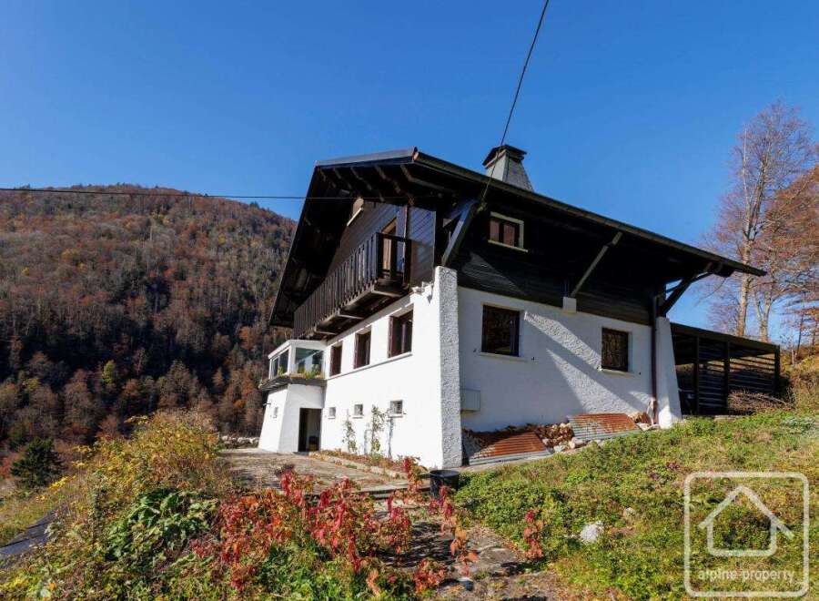 Nestled in the mountains, this stunning chalet boasts a unique architectural design, blending modern and traditional elements.