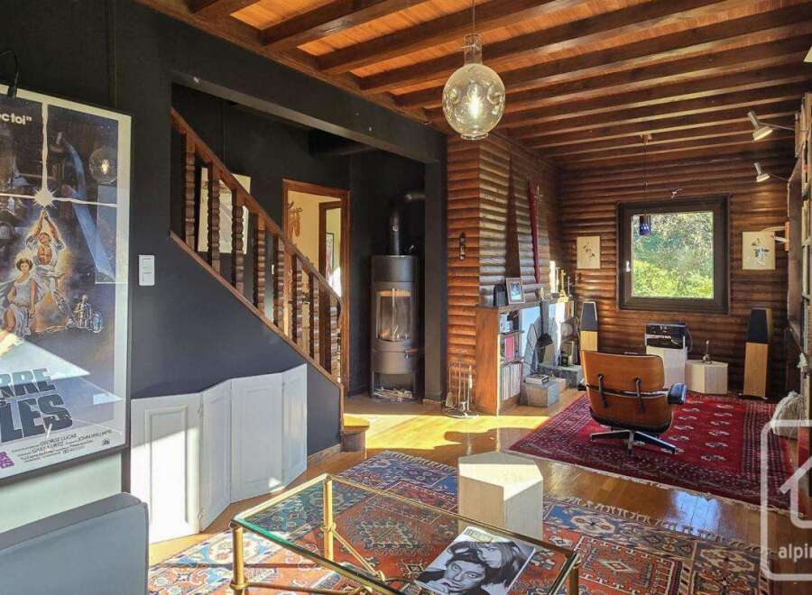This stunning log cabin boasts a unique blend of rustic charm and modern amenities.