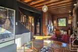 This stunning log cabin boasts a unique blend of rustic charm and modern amenities.