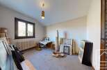 This charming attic room boasts ample natural light from its large window, creating a bright and airy atmosphere.