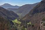 Nestled in a serene valley, this property offers breathtaking views of majestic mountains and lush greenery.
