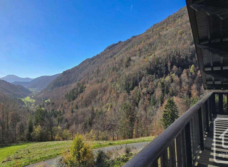 This stunning property boasts breathtaking panoramic views of the valley and surrounding mountains.