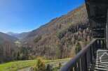 This stunning property boasts breathtaking panoramic views of the valley and surrounding mountains.
