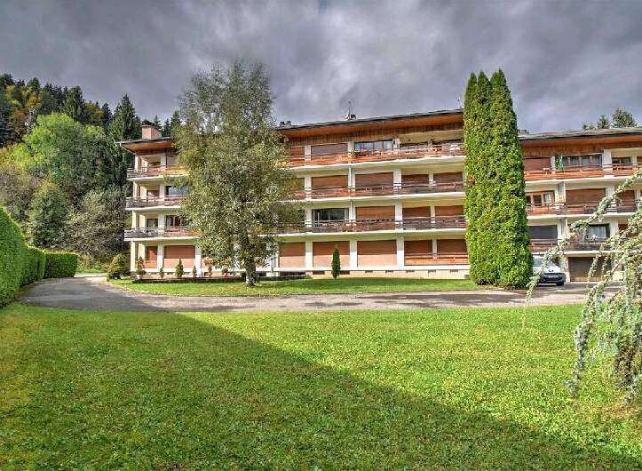 This stunning apartment building boasts a picturesque setting, nestled amidst lush greenery and offering breathtaking views.
