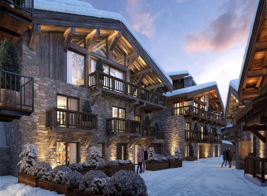 Luxury chalet apartments in the French Alps, boasting stunning mountain views and exquisite architecture.