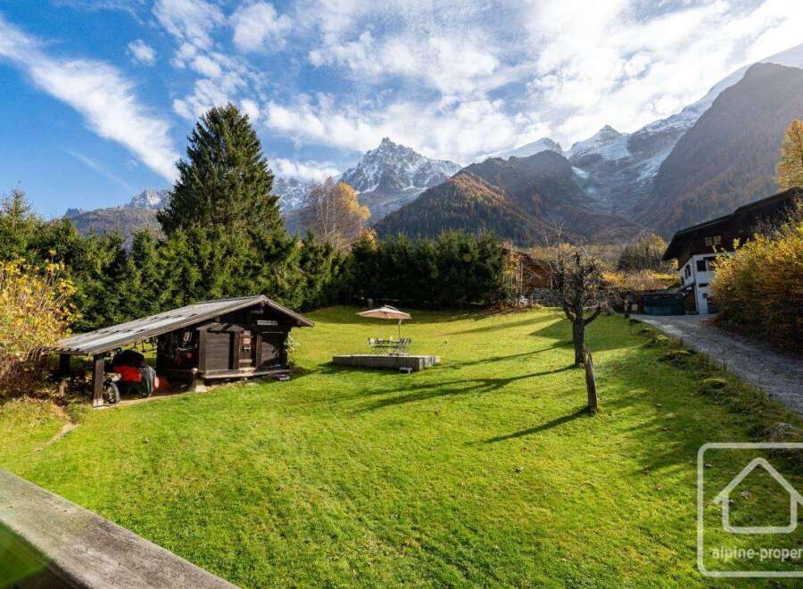 Nestled in the breathtaking French Alps, this charming property boasts a spacious lawn perfect for outdoor enjoyment, complemented by a quaint wooden shed.