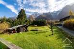 Nestled in the breathtaking French Alps, this charming property boasts a spacious lawn perfect for outdoor enjoyment, complemented by a quaint wooden shed.
