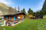 This charming chalet boasts a picturesque setting in the French Alps, offering breathtaking mountain views.