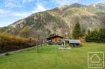 Nestled in the French Alps, this charming chalet boasts stunning mountain views and a spacious garden.