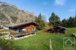 Nestled in the French Alps, this charming chalet boasts stunning mountain views and a spacious garden.