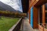 This stunning chalet boasts a spacious balcony with breathtaking mountain views, perfect for enjoying the crisp alpine air.