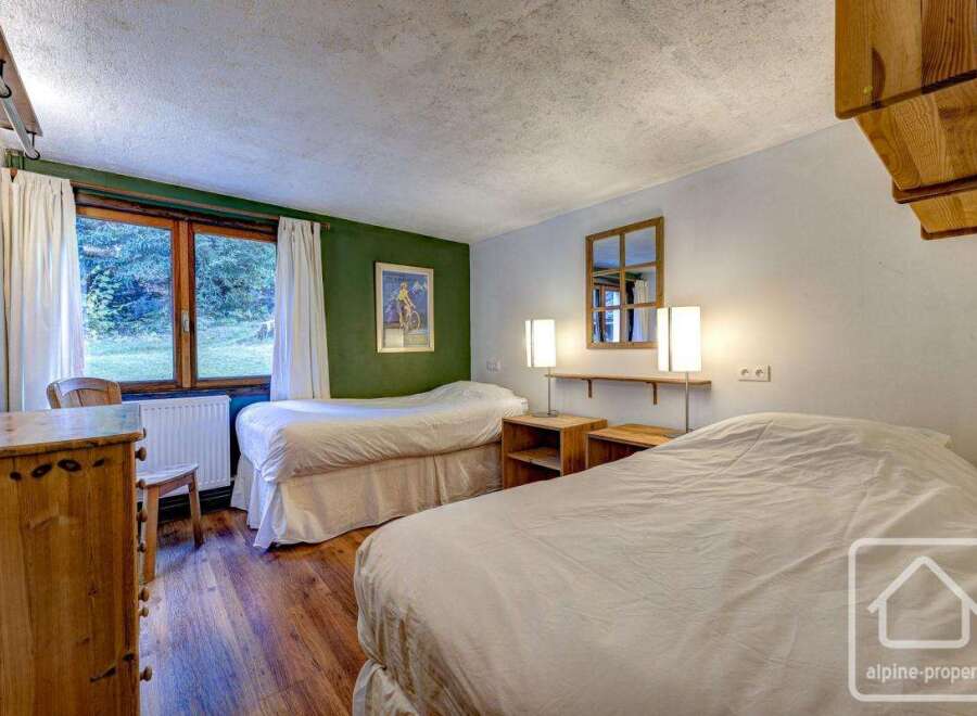 This charming bedroom features two comfortable twin beds, perfect for a relaxing stay.