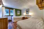 This charming bedroom features two comfortable twin beds, perfect for a relaxing stay.