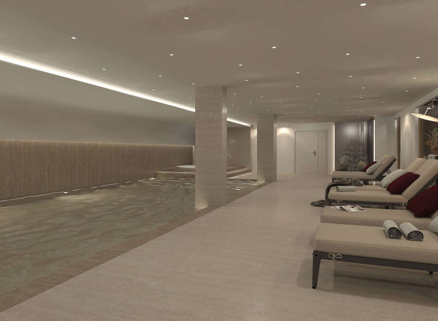 Indulge in the tranquility of this luxurious indoor pool and spa area.
